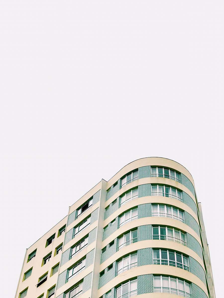 high rise white and gray cement building town